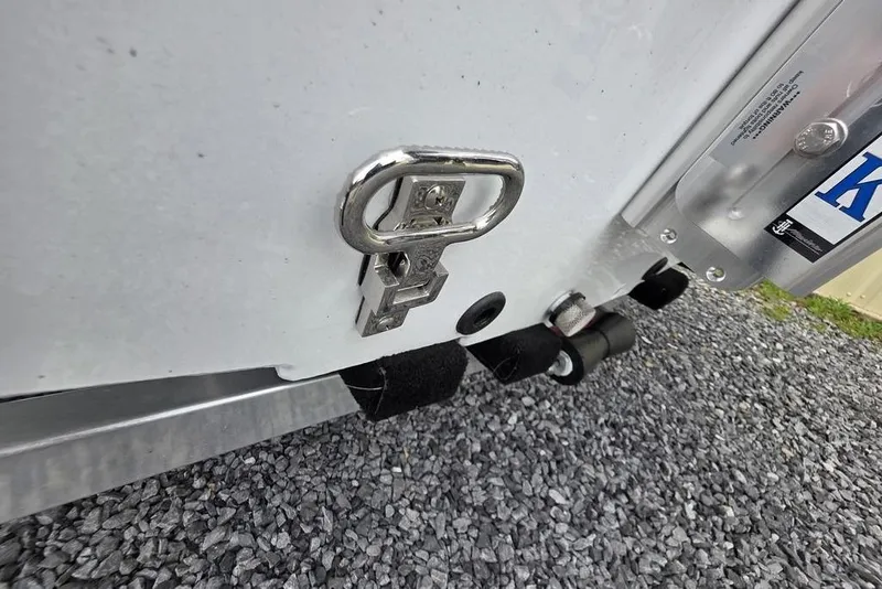 Slide: The Image of Close-up of 2026 Xpress H20CC boat trailer hitch on gravel surface. - 4