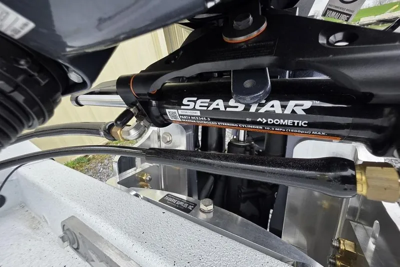 Slide: The Image of Close-up of SeaStar hydraulic steering system on 2026 Xpress H20CC boat. - 8