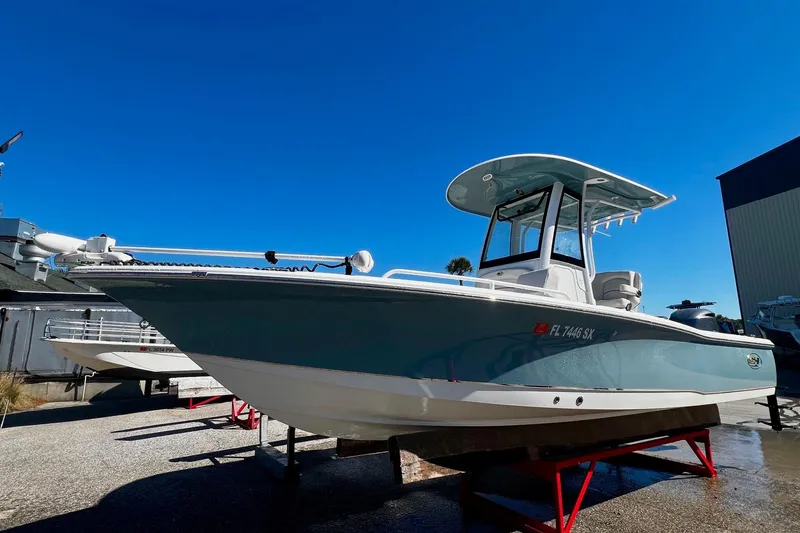 The Image of 2021 Sea Hunt BX 25 FS boat on display under clear blue sky. - 0