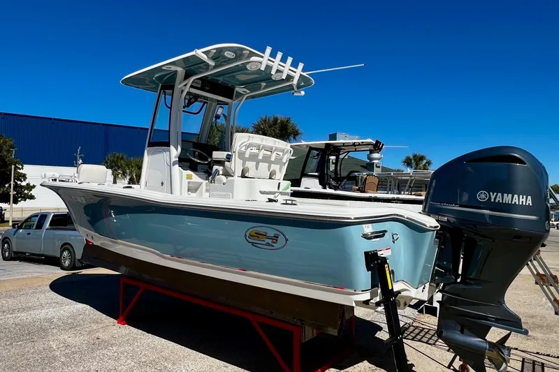 Slide: The Image of 2021 Sea Hunt BX 25 FS boat with Yamaha engine on display outdoors. - 17