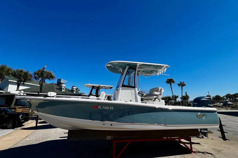 Slide: The Image of 2021 Sea Hunt BX 25 FS boat on trailer under clear blue sky. - 19