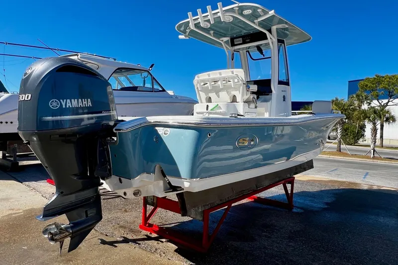 Slide: The Image of 2021 Sea Hunt BX 25 FS boat with Yamaha engine on display. - 2