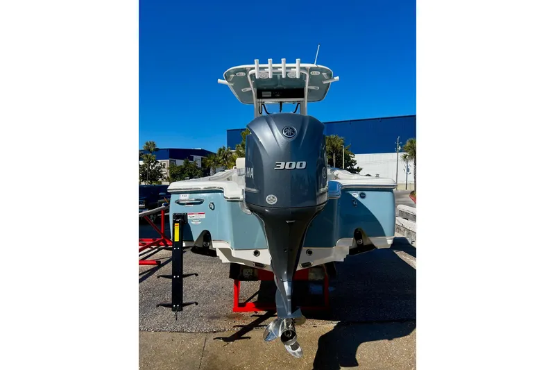 Slide: The Image of 2021 Sea Hunt BX 25 FS boat with Yamaha 300 engine, displayed outdoors. - 4