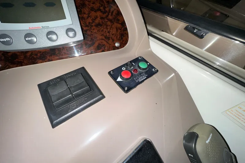 Slide: The Image of Control panel of a 2004 Regal Commodore 3860 boat with navigation buttons. - 11