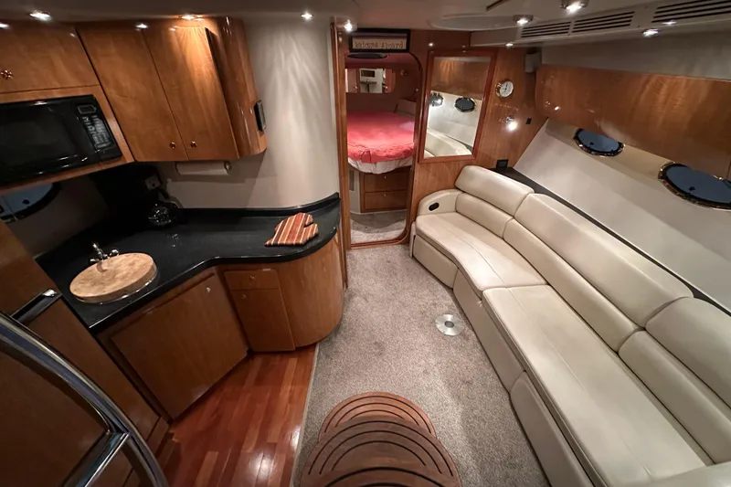 Slide: The Image of Luxurious interior of 2004 Regal Commodore 3860 yacht with kitchen and seating area. - 12
