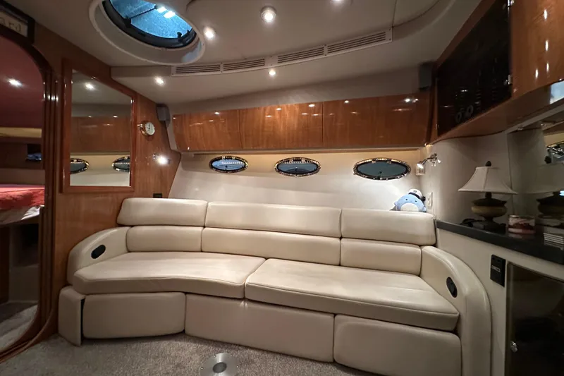 Slide: The Image of Luxurious interior of 2004 Regal Commodore 3860 yacht with plush seating and elegant lighting. - 13