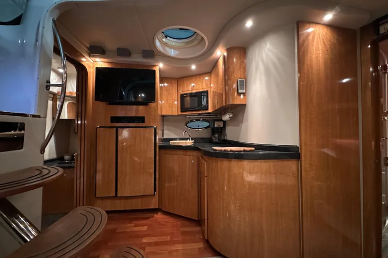 Slide: The Image of Luxurious interior of 2004 Regal Commodore 3860 yacht with modern kitchen amenities. - 14