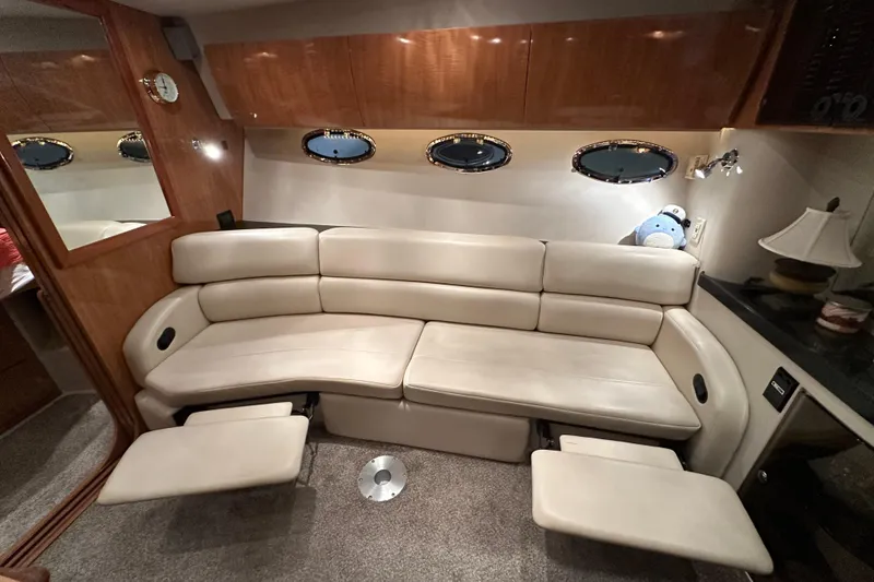 Slide: The Image of Luxurious interior of 2004 Regal Commodore 3860 yacht with plush seating and elegant decor. - 16
