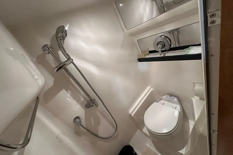Slide: The Image of Bathroom interior of 2004 Regal Commodore 3860 yacht with shower and toilet. - 26
