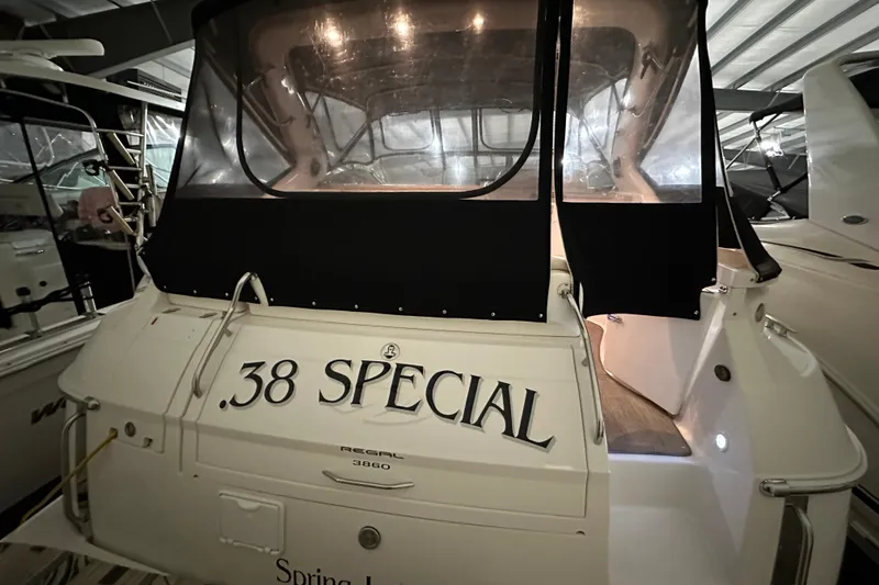 Slide: The Image of 2004 Regal Commodore 3860 yacht with ".38 Special" name, docked indoors. - 3