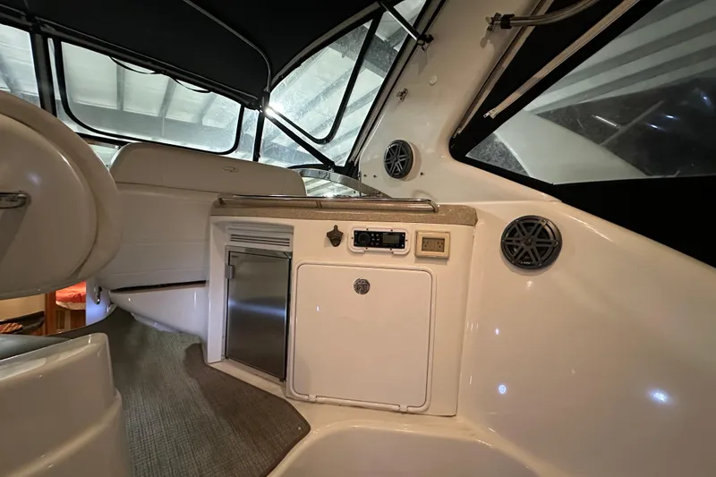 Slide: The Image of Interior of 2004 Regal Commodore 3860 yacht with kitchenette and seating area. - 5