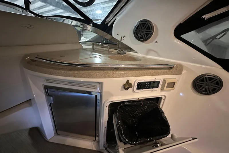 Slide: The Image of 2004 Regal Commodore 3860 yacht interior with kitchenette, sink, and storage compartments. - 7