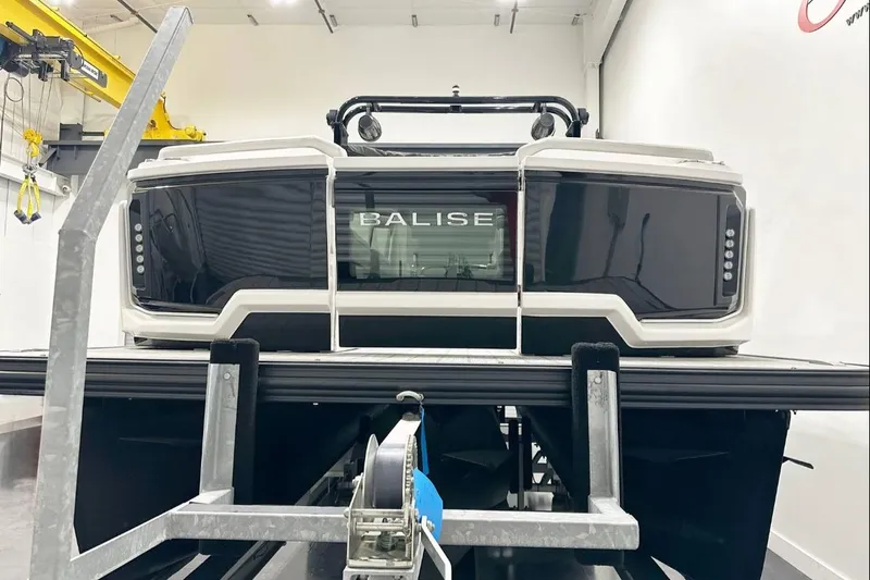 Slide: The Image of 2025 Balise Helix 24C boat in a workshop, showcasing sleek design and modern features. - 6