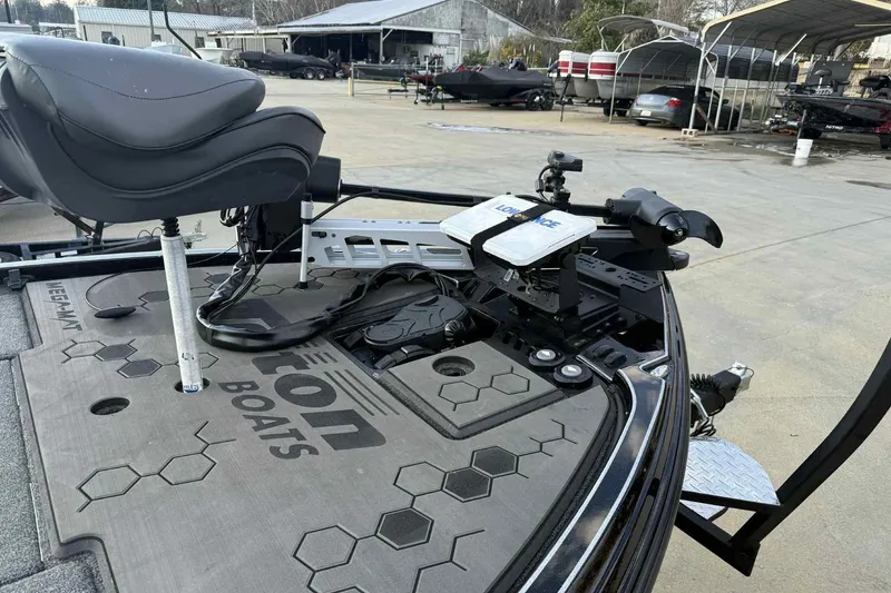 Slide: The Image of 2024 Triton 20XP Patriot boat deck with seat and fishing equipment. - 2