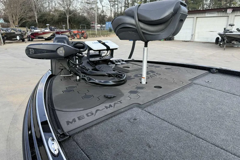 Slide: The Image of 2024 Triton 20XP Patriot boat deck with seat and trolling motor. - 7