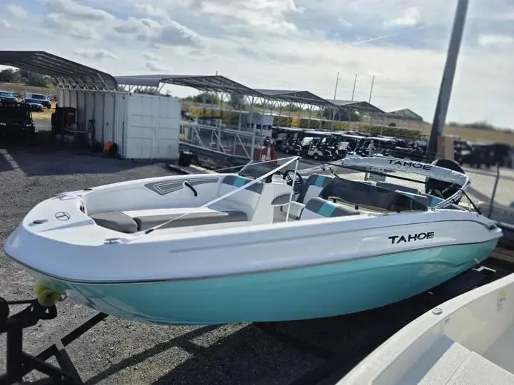 The Image of 2026 Tahoe T21 boat on a trailer outdoors. - 1