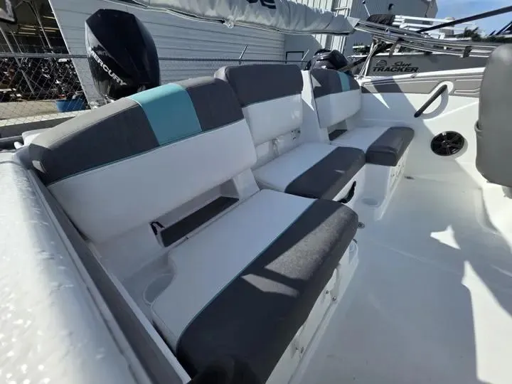 Slide: The Image of Interior of 2026 Tahoe T21 boat with gray and blue seating. - 11