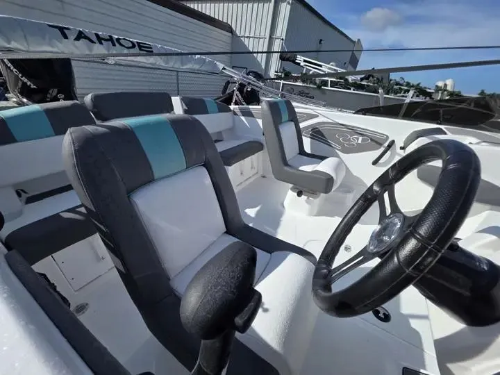 Slide: The Image of Interior of 2026 Tahoe T21 boat with steering wheel and seats. - 12