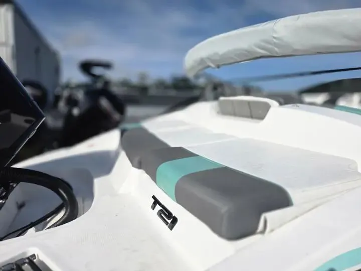 Slide: The Image of Close-up of Tahoe T21 boat, 2026 model, featuring gray and blue seating. - 7