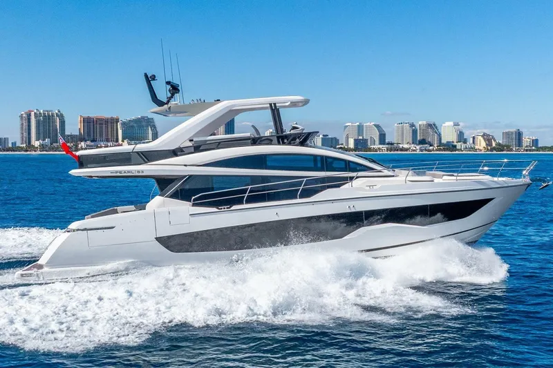 The Image of Luxury Pearl 63 yacht cruising near city skyline, 2025 model. - 0