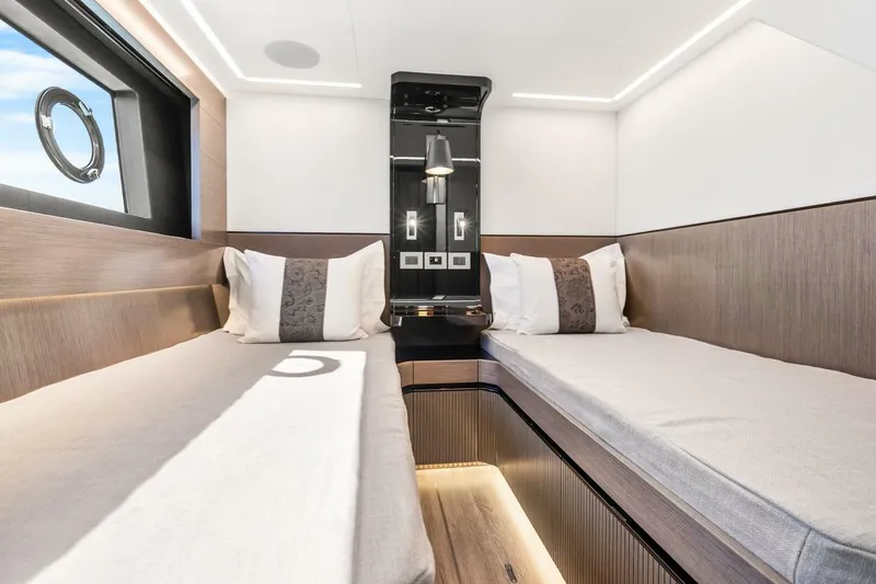 Slide: The Image of Luxurious interior of 2025 Pearl 63 yacht with twin beds and modern design. - 54