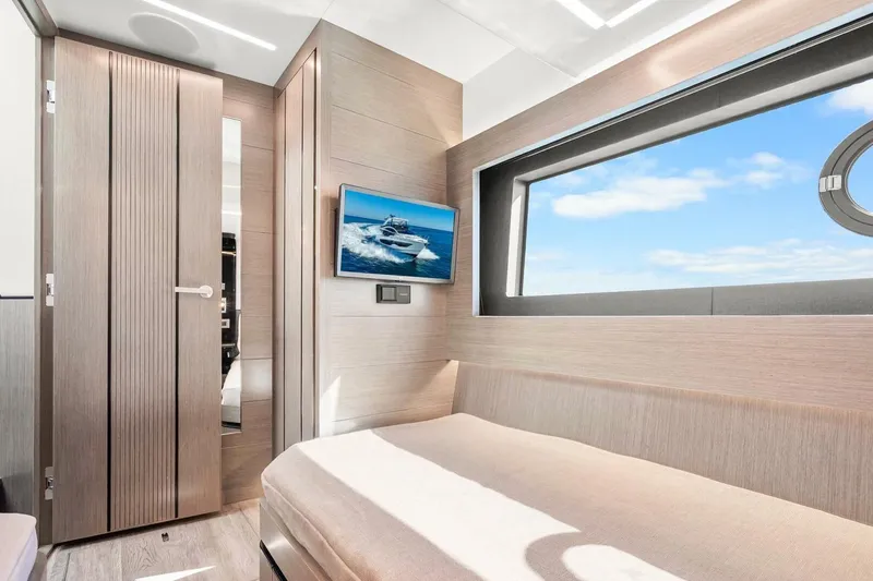 Slide: The Image of Luxurious interior of 2025 Pearl 63 yacht with modern design and large window view. - 55
