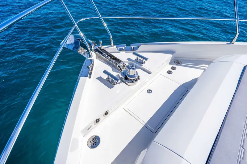 Slide: The Image of Bow of 2025 Pearl 63 yacht with anchor system, on clear blue water. - 67
