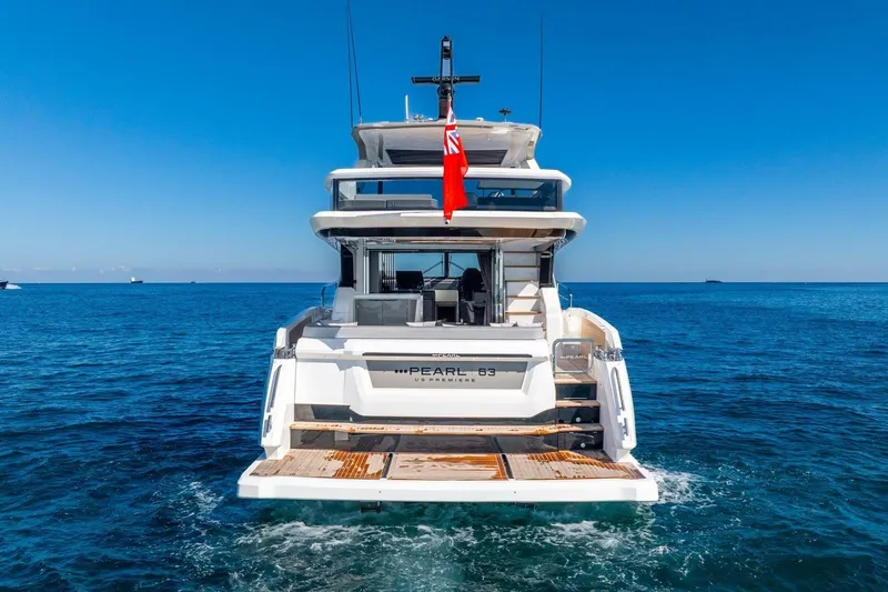 Slide: The Image of Luxury Pearl 63 yacht, 2025 model, cruising on open sea under clear blue sky. - 8