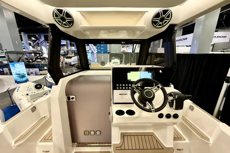 Slide: The Image of Interior view of 2026 Zodiac X9CC boat with modern steering and control panel. - 15