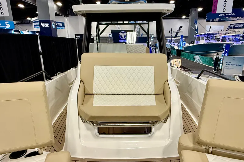 Slide: The Image of 2026 Zodiac X9CC boat interior with beige seating at a marine exhibition. - 23