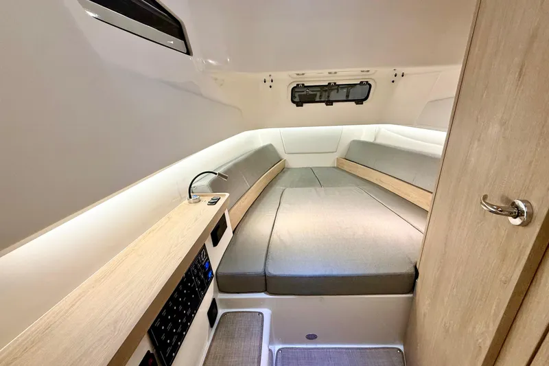 Slide: The Image of Cozy interior cabin of 2026 Zodiac X9CC boat with modern design and comfortable seating. - 25