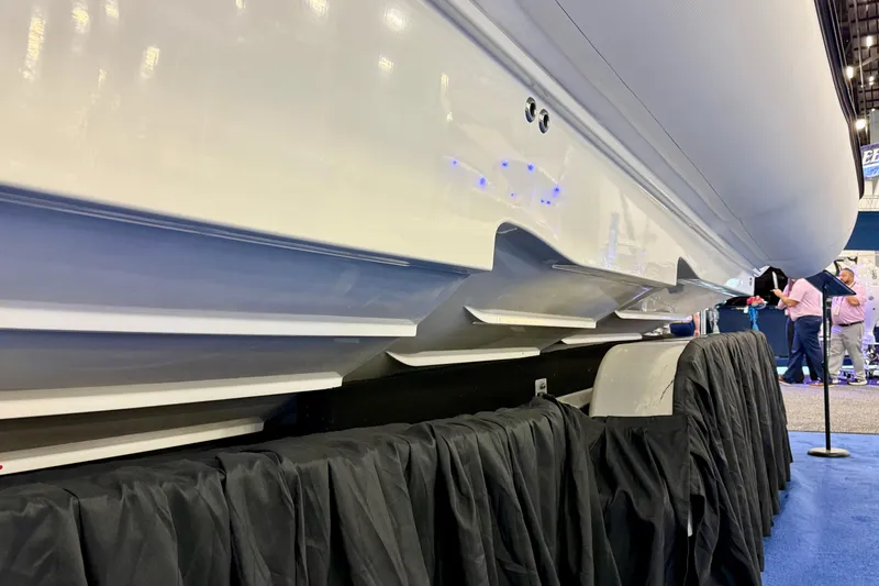 Slide: The Image of 2026 Zodiac X9CC boat hull displayed at an indoor exhibition. - 4