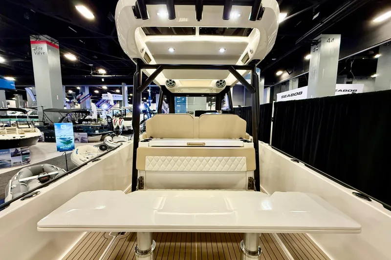 Slide: The Image of 2026 Zodiac X9CC boat interior at a showroom, featuring seating and modern design elements. - 7