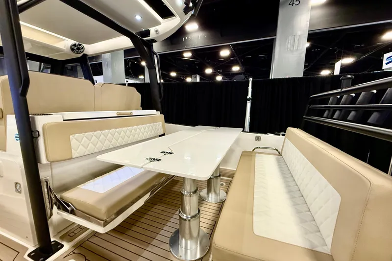 Slide: The Image of Luxurious interior of 2026 Zodiac X9CC boat with elegant seating and table. - 9