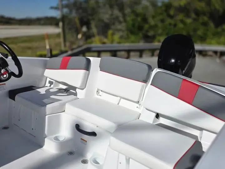 Slide: The Image of Interior of 2026 Tahoe T18 boat with white and red seating. - 14