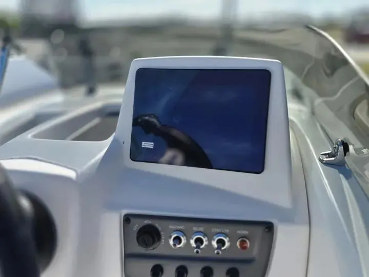 Slide: The Image of 2026 Tahoe T18 boat console with screen and controls. - 16