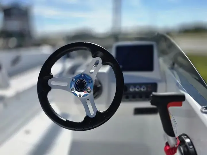 Slide: The Image of Steering wheel and controls of the 2026 Tahoe T18 boat. - 17