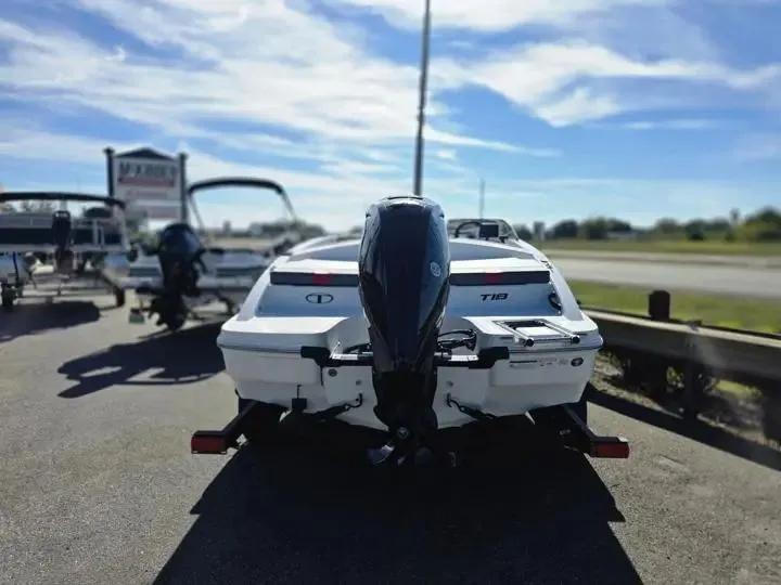 Slide: The Image of 2026 Tahoe T18 boat on a trailer under sunny skies. - 5