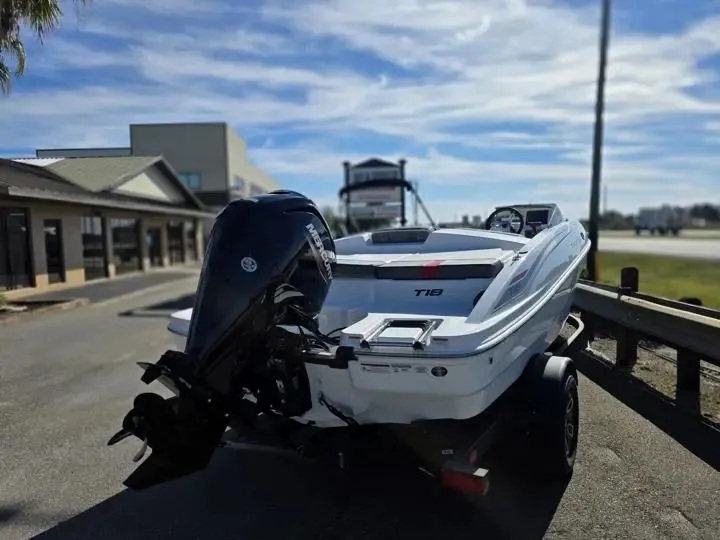 Slide: The Image of 2026 Tahoe T18 boat on a trailer, sunny day. - 6