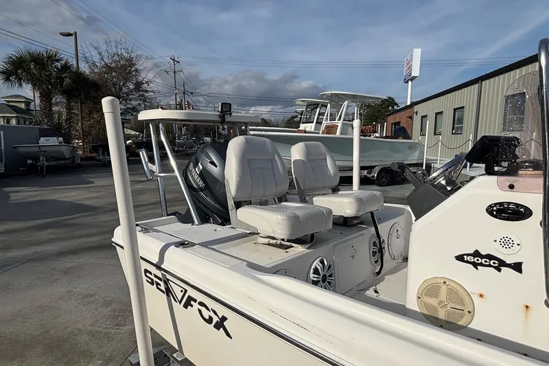 Slide: The Image of 2005 Sea Fox 160 Center Console boat with Yamaha engine, parked outdoors. - 7
