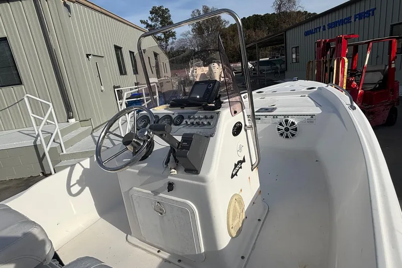 Slide: The Image of 2005 Sea Fox 160 Center Console boat with steering wheel and control panel. - 8