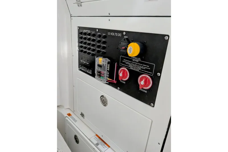 Slide: The Image of Electrical panel of 2026 Caymas 26 HB boat with switches and controls. - 10