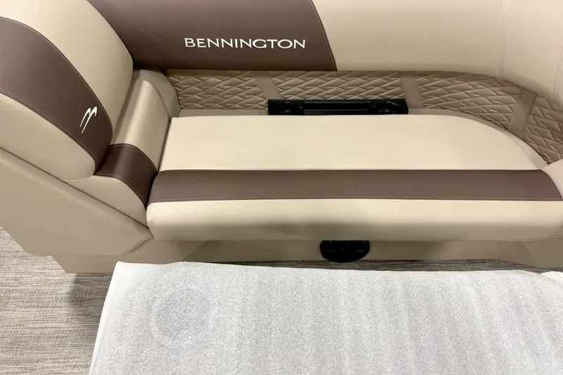 Slide: The Image of 2026 Bennington 22 SSR boat seat with beige and brown upholstery, featuring quilted design. - 12