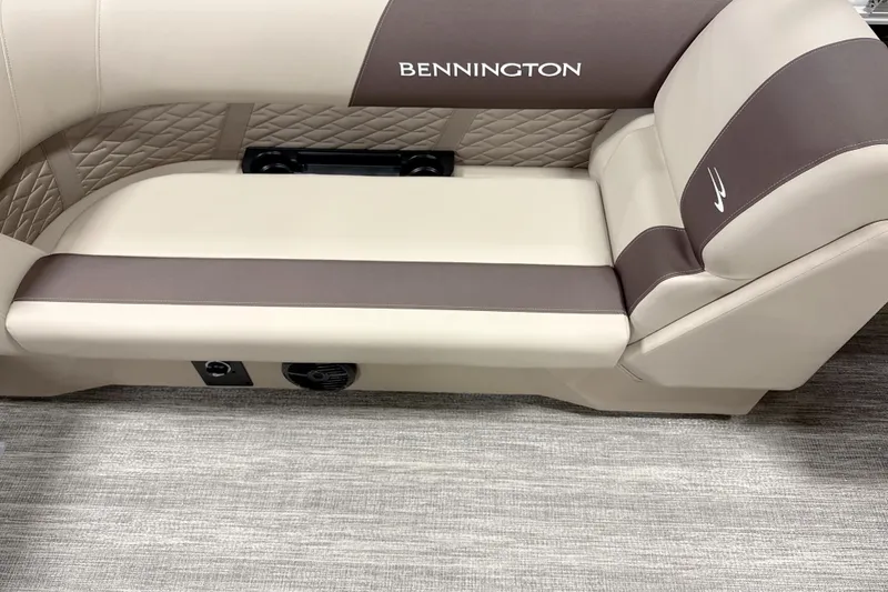 Slide: The Image of Luxurious seating in 2026 Bennington 22 SSR boat, featuring elegant beige and brown upholstery. - 13
