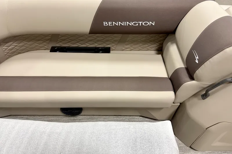 Slide: The Image of 2026 Bennington 22 SSR boat interior with beige and brown seating. - 7