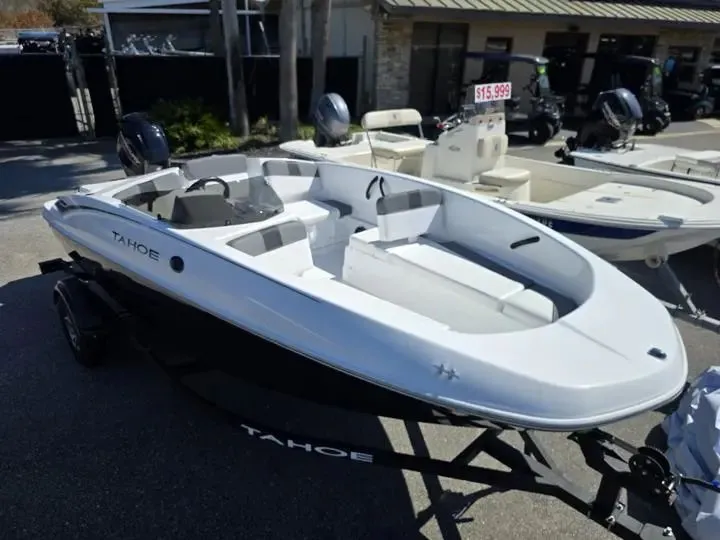 Slide: The Image of 2026 Tahoe T16 boat on trailer, priced at $15,999. - 6