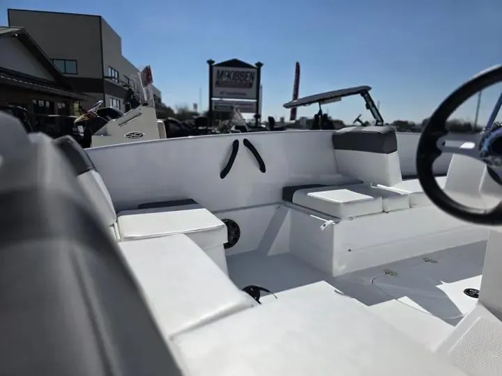 Slide: The Image of Interior of 2026 Tahoe T16 boat at a dealership. - 9