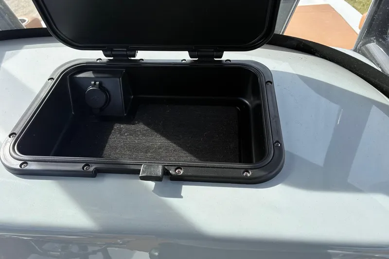 Slide: The Image of Open storage compartment on 2026 Sea Pro 250 Bay boat. - 10