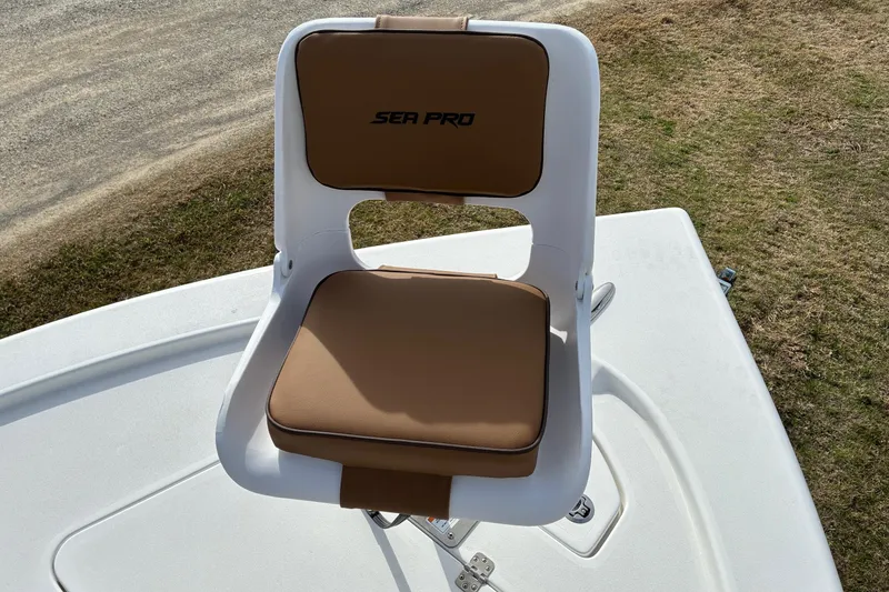 Slide: The Image of 2026 Sea Pro 250 Bay boat seat with brown cushions on deck. - 14