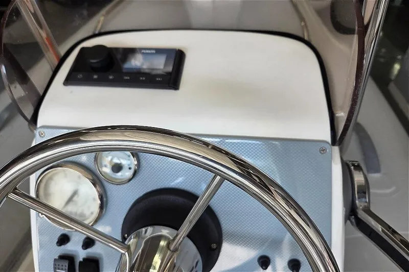 Slide: The Image of 2015 AB Inflatables Oceanus 12 VST boat interior with steering console and seating. - 7